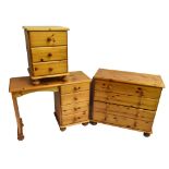 A modern pine three piece bedroom suite comprising knee hole dressing table, 72 x 96 x 38cm, a chest