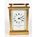 CHARLES FRODSHAM OF LONDON; a 20th century brass cased carriage clock, the white enamel dial with