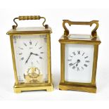 An early 20th century French brass carriage clock with white enamel dial set with Roman numerals,