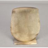 ANTONIA SALMON (born 1959); a smoke fired stoneware shield form, burnished with incised