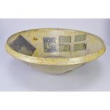 CHARLES BOUND (born 1939); an early large stoneware bowl decorated with a pattern of squares,