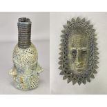 ALASDAIR NEIL MACDONELL (born 1947); a stoneware bottle form with two faces and a face mask wall