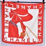 CHANEL; a 100% silk scarf featuring 'Red Lady in the Hat' pattern, in original Chanel box, 85 x