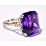 An 18ct white gold amethyst and diamond cocktail ring, the emerald cut amethyst weighing 21.5ct with