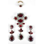 CHRISTIAN DIOR; a silver toned suite of jewellery set with ruby coloured and opalescent paste stones