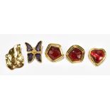 YVES SAINT LAURENT; a leaf shaped gold tone pin, a gold tone and purple butterfly clip on brooch,