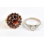 A 9ct yellow gold floral cluster dress ring, size N 1/2 (5.1g), and an 18ct white gold and glass