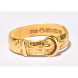 A late Victorian 22ct yellow gold buckle ring with engraved detail, Birmingham 1894, size P,