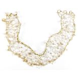 An unusual yellow metal crystal and simulated pearl choker of openwork wire design, length approx