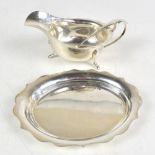 VINERS LTD; a George VI hallmarked silver sauce boat, stand and ladle, Sheffield 1950, fitted in