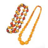 A large vintage butterscotch/egg yolk amber coloured graduated bead necklace, length 60cm, largest