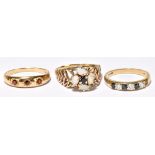 Three 9ct yellow gold dress rings, the large floral set example size O 1/2, the three stone