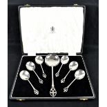 DAVIS & POWERS; an Edward VII hallmarked silver set of spoons, each with pierced fleur de lis detail