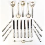 Five sterling silver soup spoons with cast detail to the handles, import marks for London 1954,