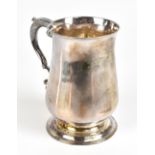 WILLIAM TURTON; a good early George III silver pint mug with scrolling loop handle, plain body and