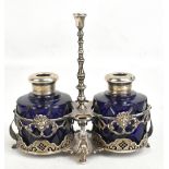 A Continental silver ink stand with pierced detail, housing two blue inkwells with diamond detail