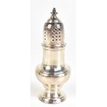 SAMUEL WOOD; a George II hallmarked silver sugar caster with pierced domed cover on spreading