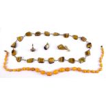 A graduated string of butterscotch amber coloured beads, length 48cm, and a suite of tiger's eye