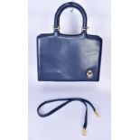 MAURICE LACROIX; a large navy blue leather handbag with detachable shoulder strap, and gold tone