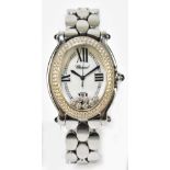 CHOPARD; a lady’s stainless steel and diamond set ‘Happy Sport’ wristwatch with oval bezel set