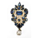 CHRISTIAN DIOR; a 1960s decorative brooch with simulated pearl drop inscribed 'Made for Christian