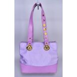 VERSACE; a purple cloth and leather handbag with gold tone hardware and embellished on the