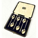 TURNER & SIMPSON LTD; a cased set of Elizabeth II hallmarked silver teaspoons with enamelled foliate