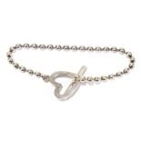 GUCCI; a sterling silver boule toggle 'Loveheart' bracelet, length 18cm (with bag and box).