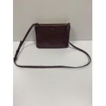 CELINE; a Trio small leather shoulder bag in burgundy, height 16cm, length 22cm