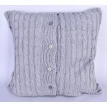 RALPH LAUREN; a grey wool knit cushion with logo.