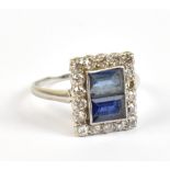 An Art Deco white metal diamond and sapphire ring, the central rectangular platform set with two