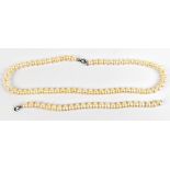 A cultured pearl necklace, length 44cm, with silver clasp and a matching bracelet., length 18cm (