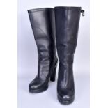 PRADA; a pair of black leather platform mid-calf boots, heel 4 inches.Additional InformationThere is