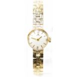 TISSOT; a lady’s 9ct yellow gold mechanical cocktail bracelet watch, the circular dial set with