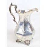 WILLIAM HUNTER (probably); a Victorian hallmarked silver jug of panelled form with chased floral