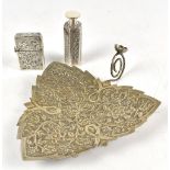 Three pieces of circa 1900 foliate decorated Indian silver comprising a hexagonal scent bottle,