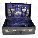 W G SOUTHERS LTD; a George V hallmarked silver five piece travelling vanity set comprising mirror,