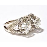 A white gold diamond set ring, the twin principal stones each weighing approx 0.75cts within a