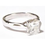 A platinum and diamond solitaire ring, the princess cut stone weighing approx 1.25ct in four claw