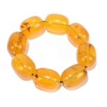 A pale amber coloured bead bracelet formed of eight matched beads, each approx 32 x 22mm, approx