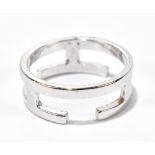 HERMES; a silver tone 'H' ring, stamped Hermes (size M).