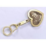 MULBERRY; a bronze embossed leather heart keyring with gold tone hardware.