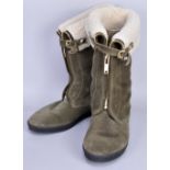 BURBERRY; a pair of sage green flat sheepskin boots with gold tone front zip (original box).