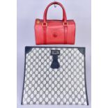 GUCCI; a GG monogrammed canvas and navy blue leather attache bag with gold tone clasp, 34 x 30,