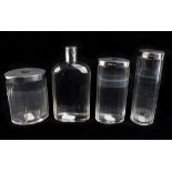 A set of four clear glass and silver mounted dressing table jars hallmarked for London 1944,