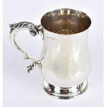 ELKINGTON & CO; an Edward VIII hallmarked silver baluster mug with scroll handle and spreading foot,