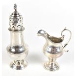 HENDELES & CO; a George V hallmarked silver cream jug with C-scroll handle on spreading circular