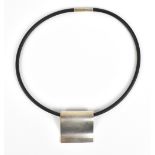 NANNA DITZEL FOR GEORG JENSEN; a sterling silver surf brooch/pendant on Neoprene necklace ring