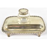 EDWARD SOUTER BARNSLEY; an Edward VII hallmarked silver ink stand with silver topped clear glass
