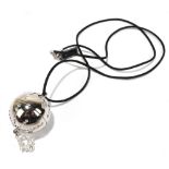 CHRISTIAN DIOR; a 'Diorlight Glosslevres' orb perfume pendant on rope, length 80cm.Additional